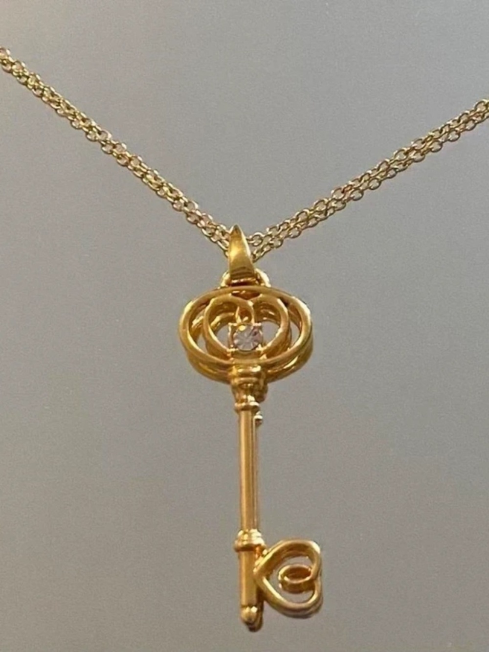 Gold key pendant necklace